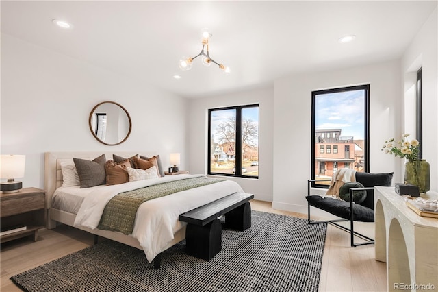 2391 King St, Denver, CO 80211 - bedroom featuring light wood-type flooring, a chandelier, and recessed lighting