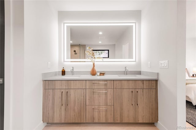 2391 King St, Denver, CO 80211 - ensuite bathroom featuring double vanity and baseboards