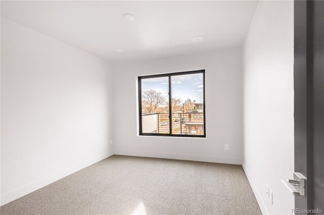 2391 King St, Denver, CO 80211 - empty room with light carpet and baseboards