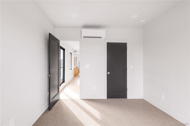 2391 King St, Denver, CO 80211 - unfurnished bedroom with an AC wall unit and light colored carpet