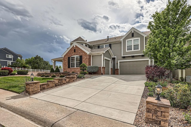 8469 Winter Berry Dr, Castle Pines, CO 80108 - view of front of property featuring brick siding, concrete driveway, a garage, and a shingled roof