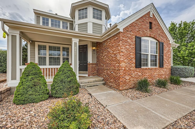 8469 Winter Berry Dr, Castle Pines, CO 80108 - view of front of home with brick siding