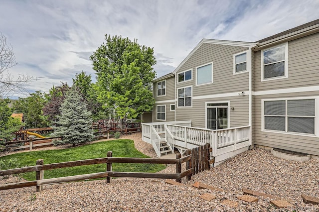 8469 Winter Berry Dr, Castle Pines, CO 80108 - rear view of house with a wooden deck