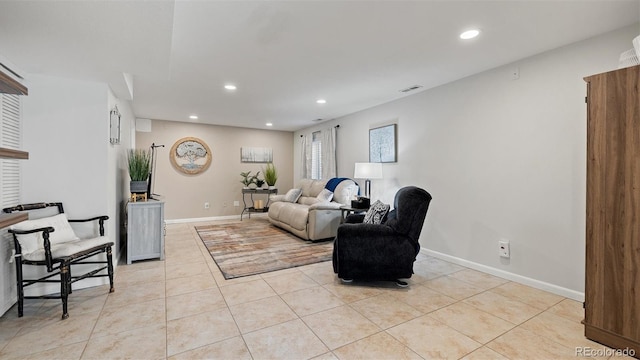 living area featuring light tile patterned floors, recessed lighting, visible vents, and baseboards