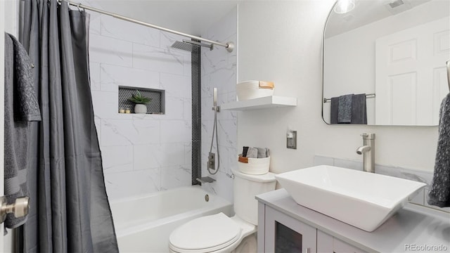 bathroom featuring vanity, toilet, visible vents, and shower / tub combo with curtain