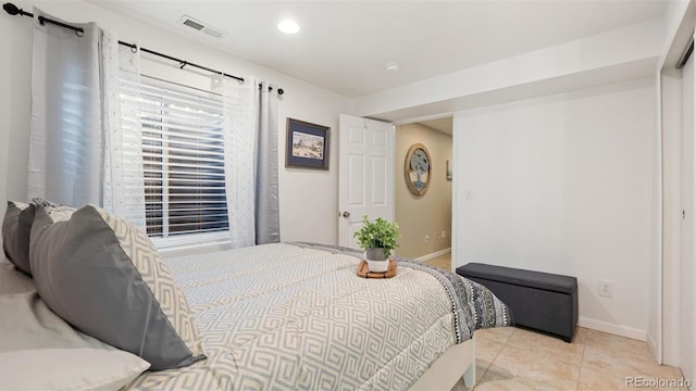 bedroom with recessed lighting, light tile patterned floors, baseboards, and visible vents