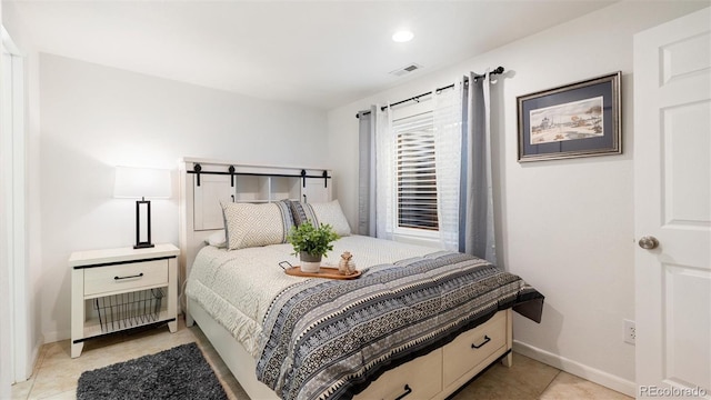 bedroom with visible vents and baseboards