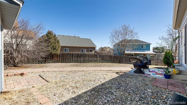 view of yard with a patio area and a fenced backyard