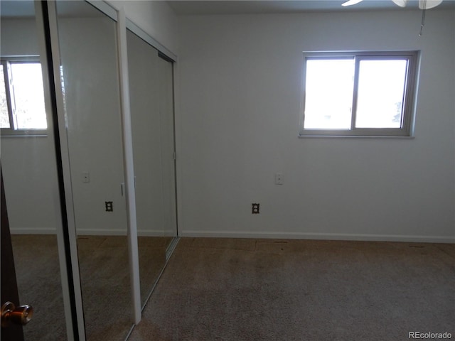 unfurnished bedroom with carpet flooring