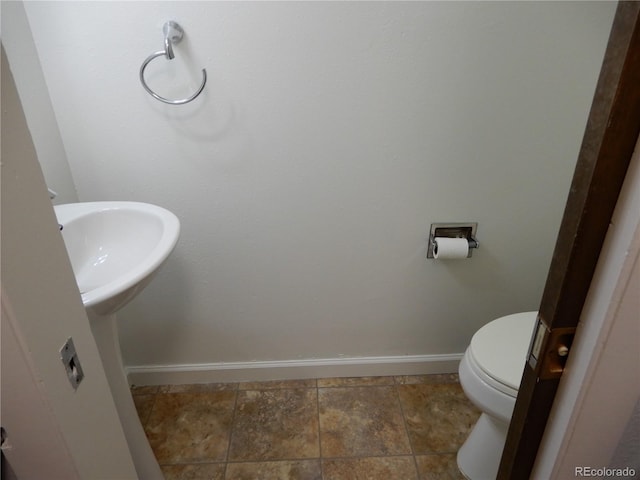 bathroom featuring toilet