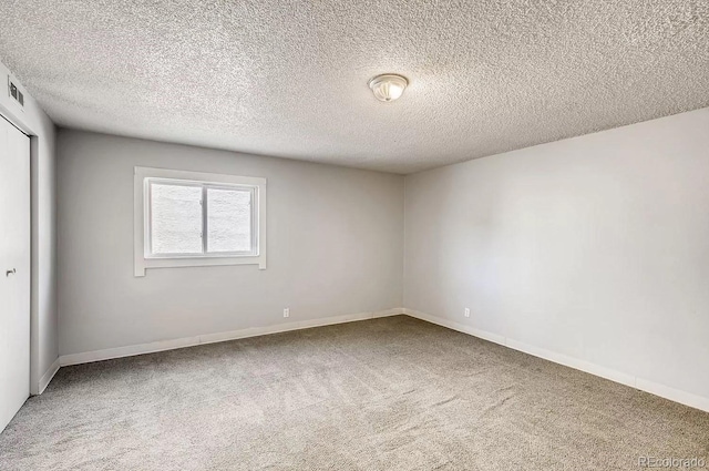 161 Mcclure Ave, Firestone, CO 80520 - carpeted empty room featuring a textured ceiling and baseboards