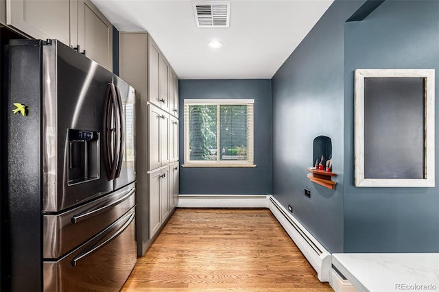 2845 Hudson St, Denver, CO 80207 - kitchen featuring stainless steel fridge with ice dispenser, a baseboard heating unit, gray cabinetry, light wood finished floors, and recessed lighting