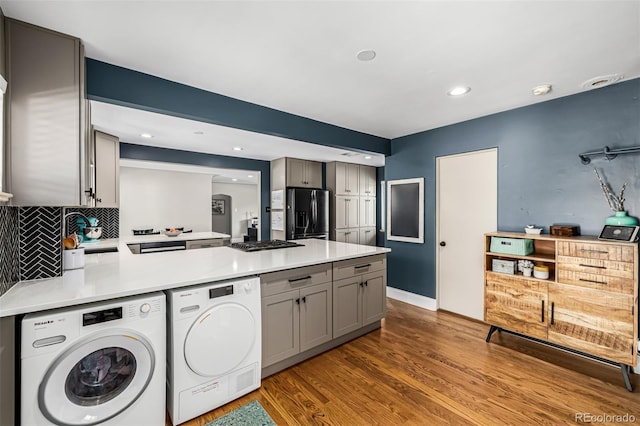 2845 Hudson St, Denver, CO 80207 - kitchen with gray cabinetry, refrigerator with ice dispenser, washer and dryer, light countertops, and recessed lighting