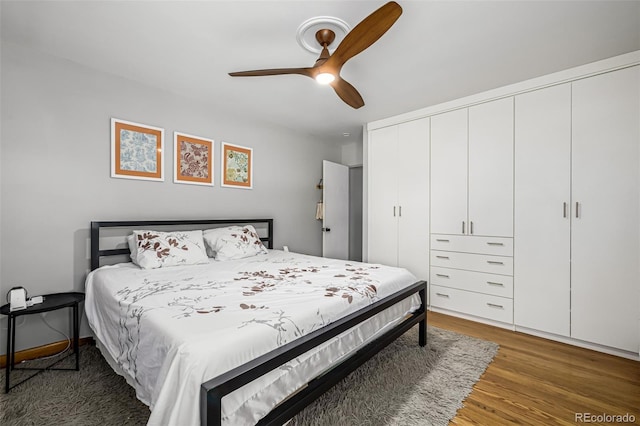 2845 Hudson St, Denver, CO 80207 - bedroom featuring wood finished floors, a closet, and a ceiling fan