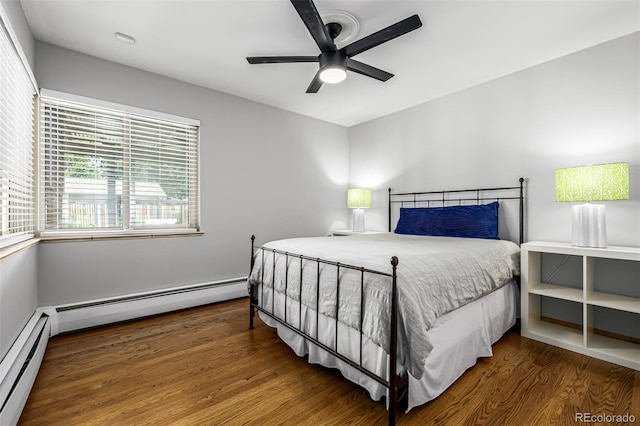 2845 Hudson St, Denver, CO 80207 - bedroom with baseboard heating, a baseboard heating unit, wood finished floors, and a ceiling fan