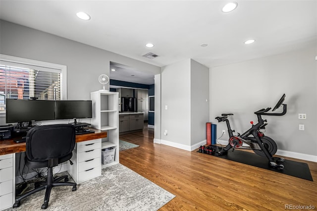 2845 Hudson St, Denver, CO 80207 - home office featuring wood finished floors and recessed lighting