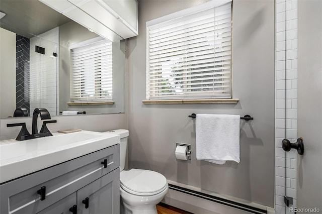 2845 Hudson St, Denver, CO 80207 - bathroom featuring baseboard heating, a stall shower, and vanity