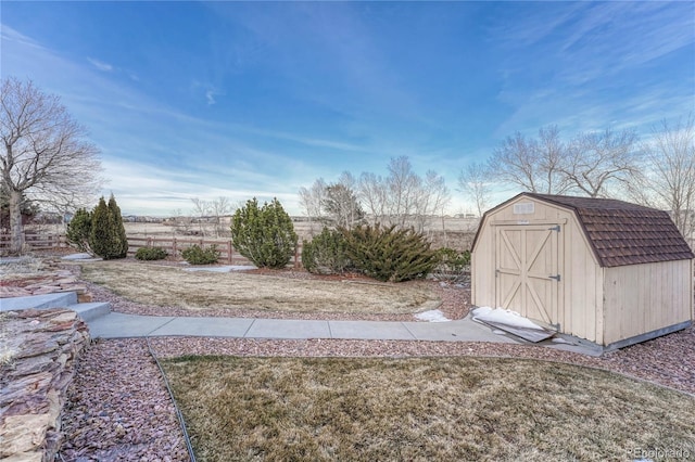 view of yard featuring an outbuilding and a storage shed