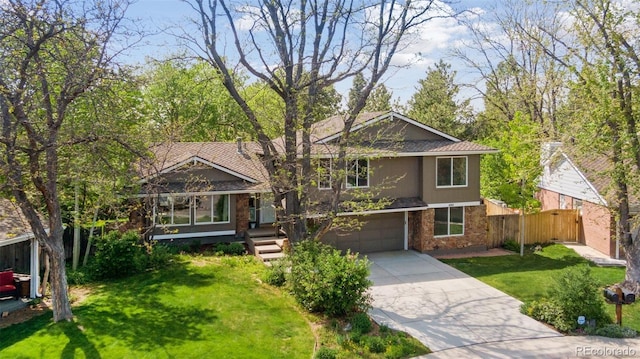 6083 S Glencoe Way, Centennial, CO 80121 - tri-level home featuring concrete driveway, brick siding, and an attached garage