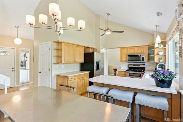 6083 S Glencoe Way, Centennial, CO 80121 - kitchen featuring open shelves, stainless steel appliances, a peninsula, a ceiling fan, and light brown cabinets
