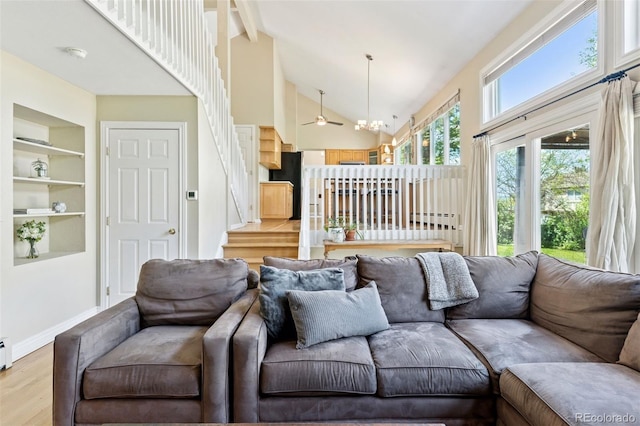 6083 S Glencoe Way, Centennial, CO 80121 - living area featuring high vaulted ceiling, beamed ceiling, light wood-style flooring, a ceiling fan, and stairs