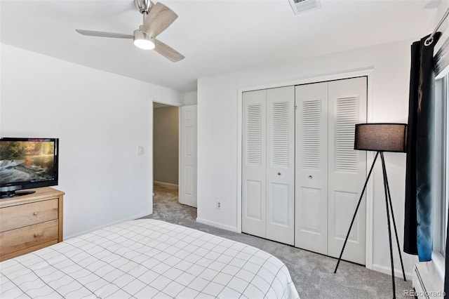 6083 S Glencoe Way, Centennial, CO 80121 - bedroom featuring light carpet, a closet, a ceiling fan, and baseboards