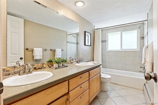 6083 S Glencoe Way, Centennial, CO 80121 - full bath featuring a baseboard radiator, shower / tub combo with curtain, toilet, double vanity, and tile patterned flooring