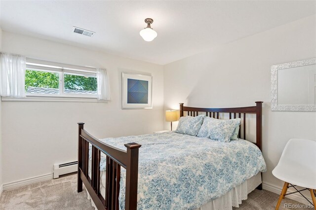 6083 S Glencoe Way, Centennial, CO 80121 - bedroom featuring a baseboard heating unit, baseboards, and light colored carpet