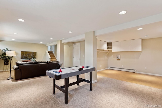 6083 S Glencoe Way, Centennial, CO 80121 - recreation room with a baseboard heating unit, light colored carpet, recessed lighting, and baseboards