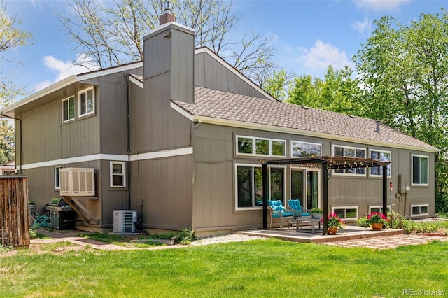 6083 S Glencoe Way, Centennial, CO 80121 - rear view of house with a chimney, a patio area, a yard, and central AC unit
