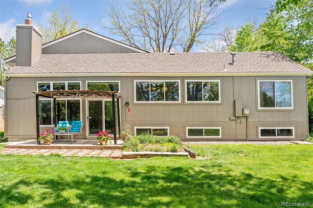 6083 S Glencoe Way, Centennial, CO 80121 - back of house with a chimney, a lawn, a shingled roof, and a patio area