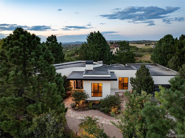 view of front of property with solar panels