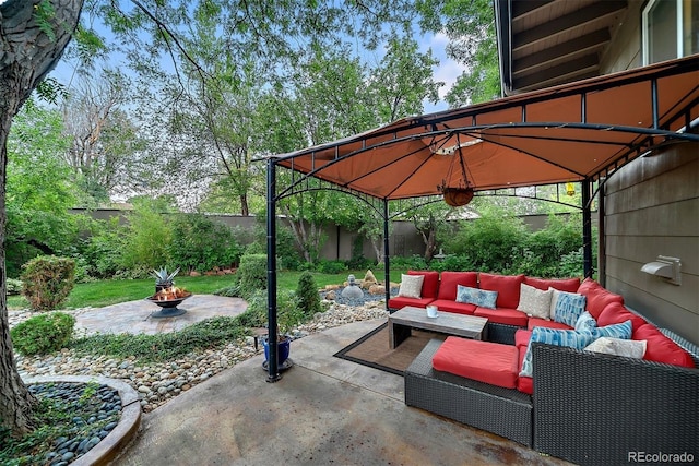 view of patio / terrace with a fenced backyard, outdoor lounge area, and a gazebo