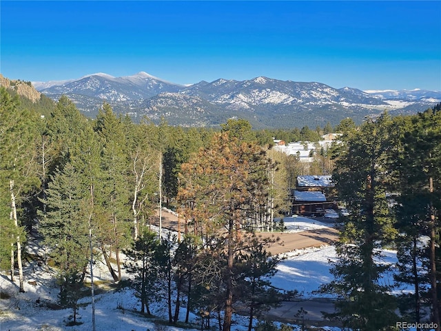 6241 Kilimanjaro Dr, Evergreen, CO 80439 - view of mountain backdrop with a heavily wooded area