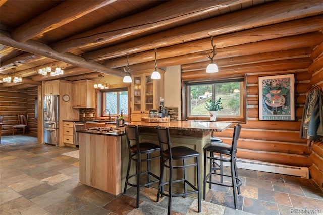 6241 Kilimanjaro Dr, Evergreen, CO 80439 - kitchen featuring light brown cabinets, wood ceiling, dark countertops, and appliances with stainless steel finishes