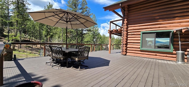 6241 Kilimanjaro Dr, Evergreen, CO 80439 - wooden terrace featuring outdoor dining area