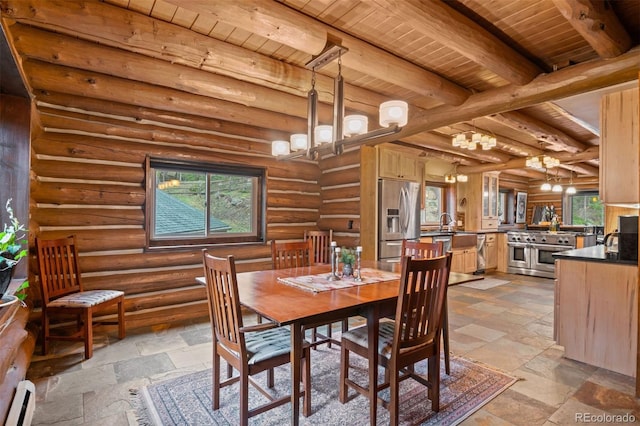 6241 Kilimanjaro Dr, Evergreen, CO 80439 - dining space with a notable chandelier, a healthy amount of sunlight, stone tile floors, and wooden ceiling