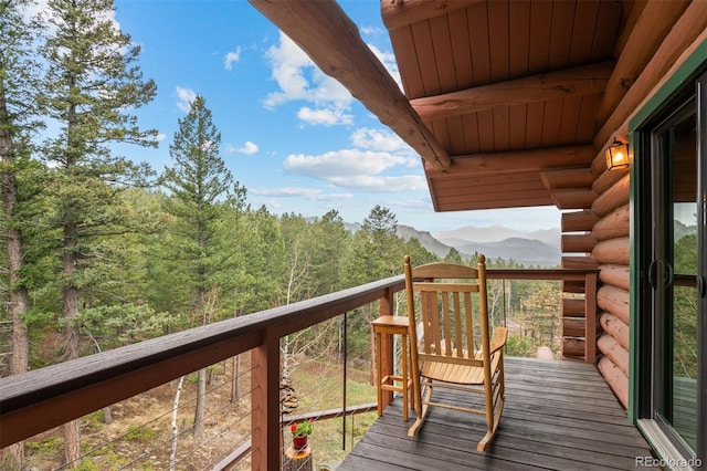 6241 Kilimanjaro Dr, Evergreen, CO 80439 - balcony featuring a view of trees and a mountain view