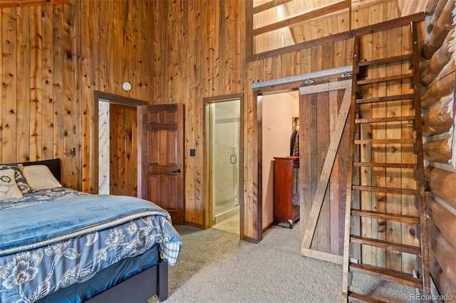 6241 Kilimanjaro Dr, Evergreen, CO 80439 - bedroom with wood walls, carpet flooring, a towering ceiling, and ensuite bath