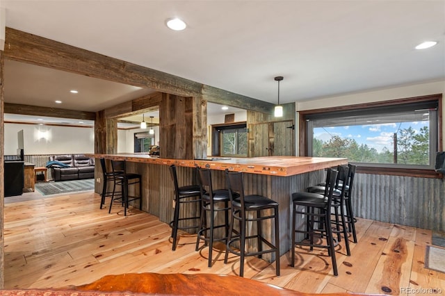 6241 Kilimanjaro Dr, Evergreen, CO 80439 - indoor bar with light wood-style floors, beam ceiling, pendant lighting, and recessed lighting