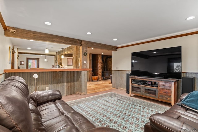 6241 Kilimanjaro Dr, Evergreen, CO 80439 - living area featuring wood finished floors, wainscoting, recessed lighting, ornamental molding, and beamed ceiling