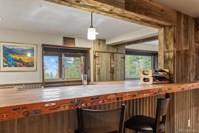 6241 Kilimanjaro Dr, Evergreen, CO 80439 - bar featuring wood walls and decorative light fixtures