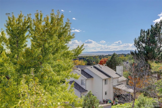 birds eye view of property featuring a mountain view