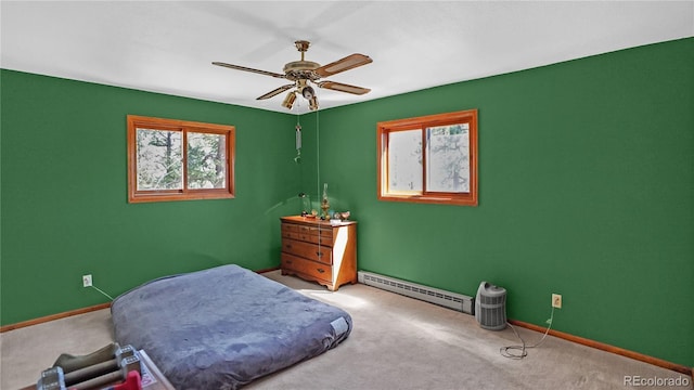 1269 Roland Dr, Bailey, CO 80421 - carpeted bedroom featuring a baseboard radiator, baseboards, and a ceiling fan