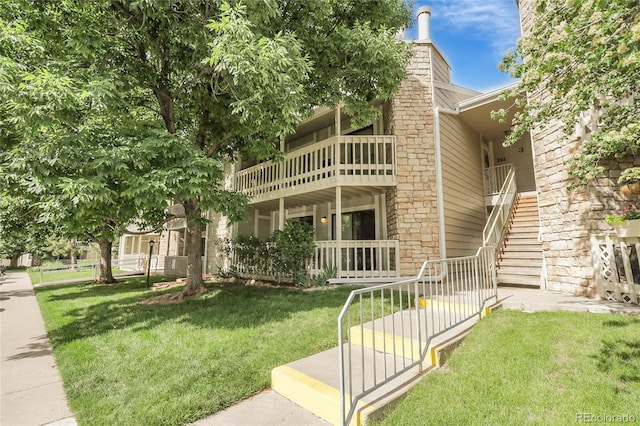 8225 Fairmount Dr Unit 102, Denver, CO 80247 - view of front facade featuring a front yard and stairway