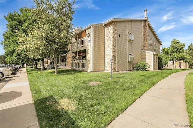 8225 Fairmount Dr Unit 102, Denver, CO 80247 - view of building exterior featuring cooling unit and a wall mounted AC