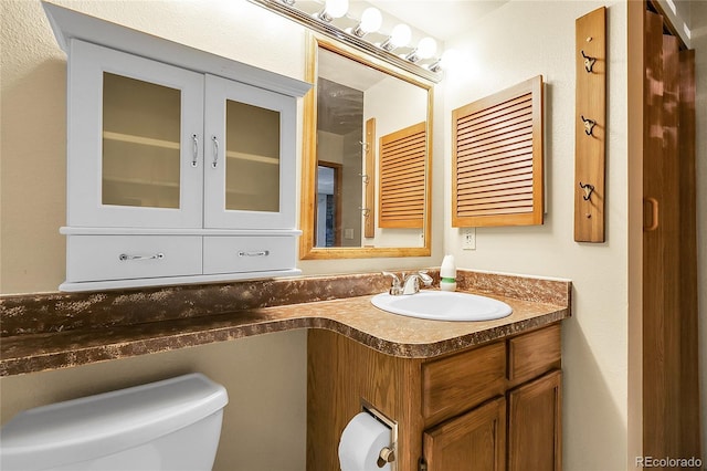 8225 Fairmount Dr Unit 102, Denver, CO 80247 - bathroom featuring toilet and vanity