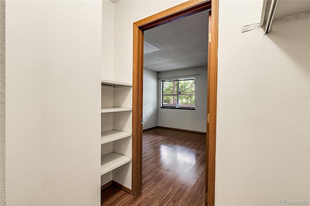 8225 Fairmount Dr Unit 102, Denver, CO 80247 - walk in closet featuring dark wood-style flooring