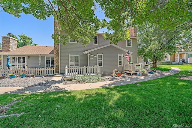 8438 Everett Way Unit B, Arvada, CO 80005 - rear view of property with a chimney