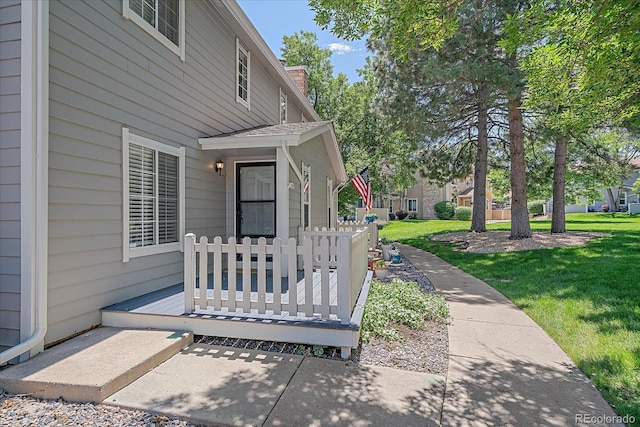 8438 Everett Way Unit B, Arvada, CO 80005 - view of exterior entry featuring a lawn